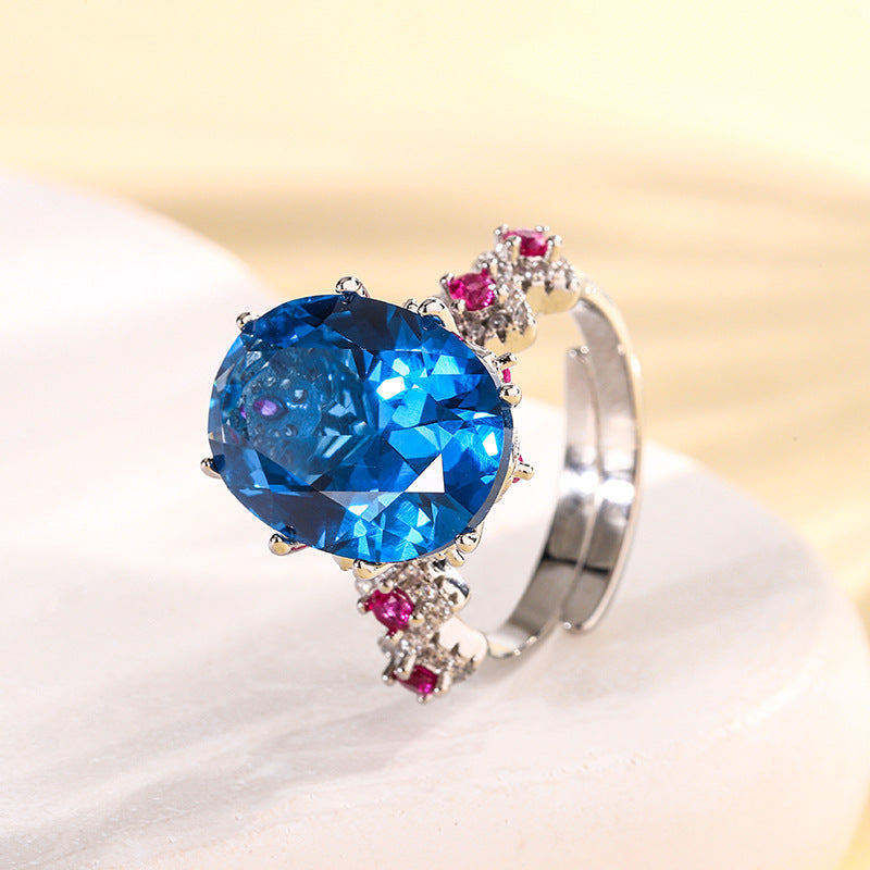 Urqanyu copper base gold-plated simulated colored gem corundum egg-shaped jump color creative cubic zirconia ring