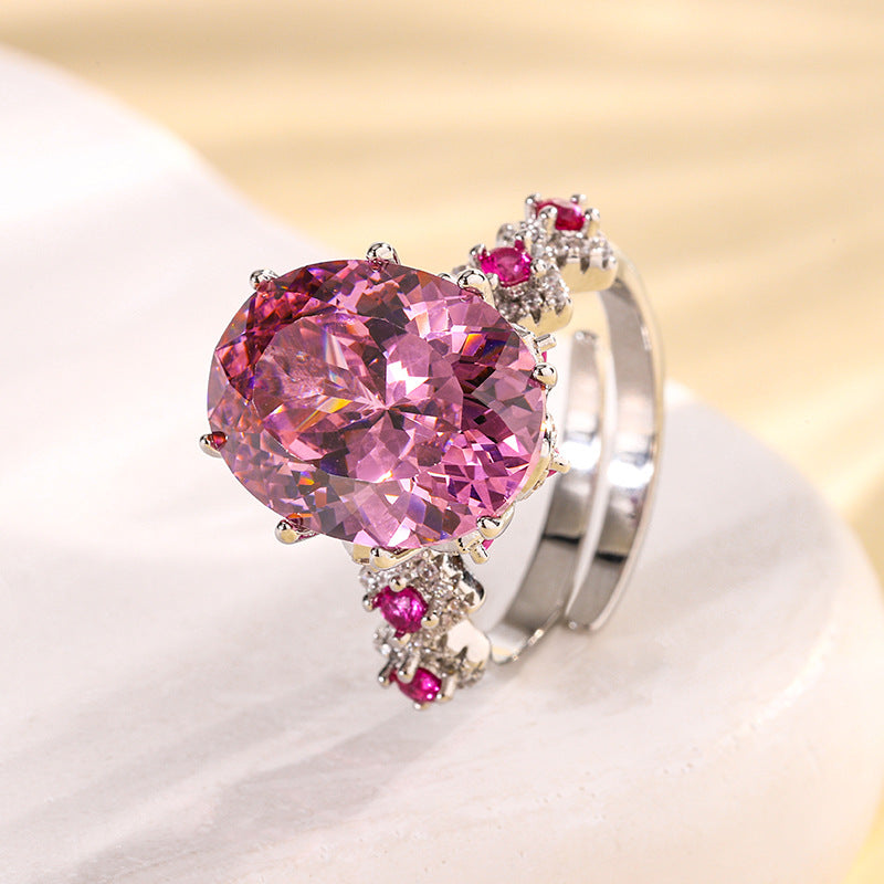 Urqanyu copper base gold-plated simulated colored gem corundum egg-shaped jump color creative cubic zirconia ring