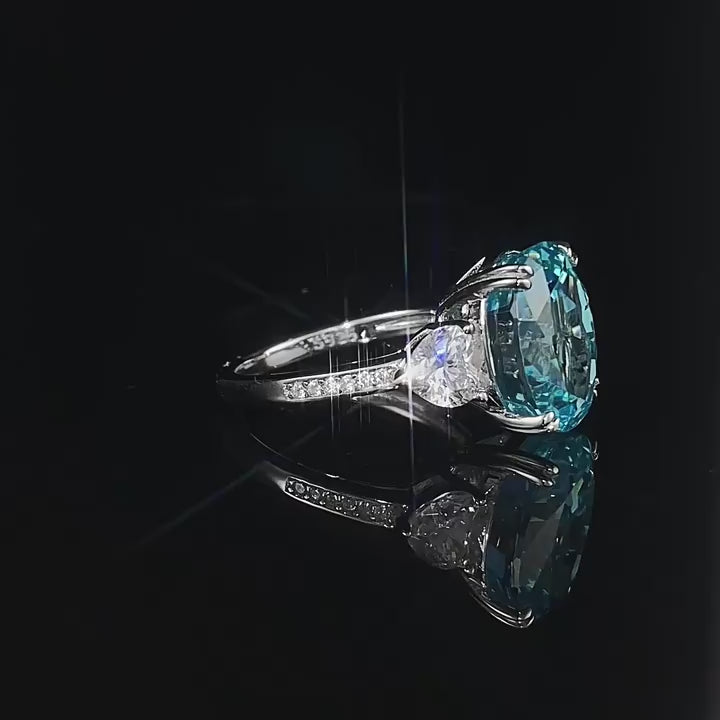 Load video: Urqanyu S925 silver sea blue ice flower cut oval cubic zirconia ring 10*12