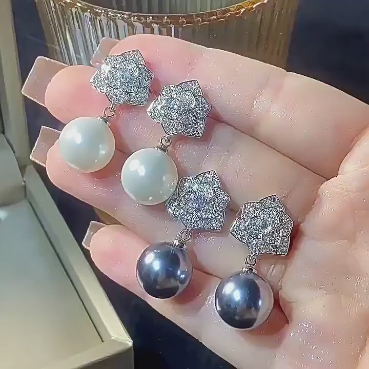 Load video: Urqanyu copper-based gold-plated inlaid pearl camellia cubic zirconia earrings