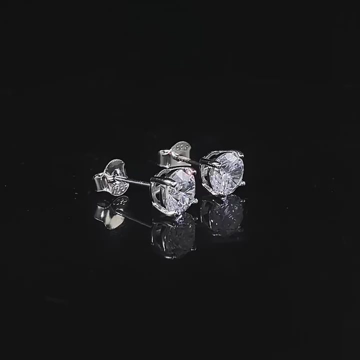 Load video: Urqanyu S925 silver one carat classic round cut simulation diamond fashionable all-match cubic zirconia earrings